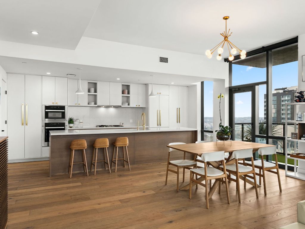 70 Rainey Street, Unit 2301 Austin, TX 78701 - Photo 12 of 40 a view of a dining room with furniture and wooden floor