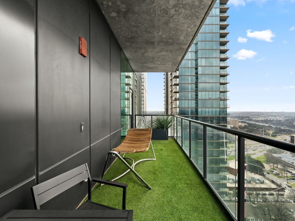 70 Rainey Street, Unit 2301 Austin, TX 78701 - Photo 17 of 40 a view of a chairs and table in balcony