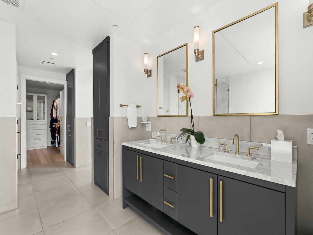 70 Rainey Street, Unit 2301 Austin, TX 78701 - Photo 28 of 40 a bathroom with a double vanity sink and a mirror