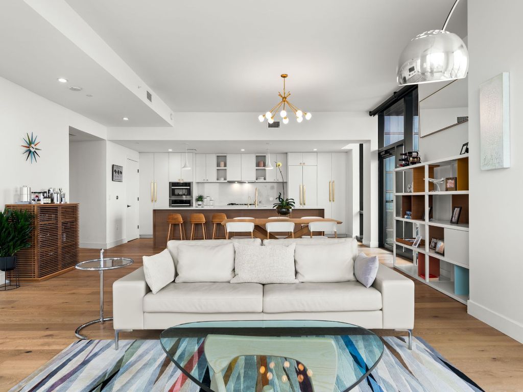 70 Rainey Street, Unit 2301 Austin, TX 78701 - Photo 3 of 40 a living room with furniture and a chandelier