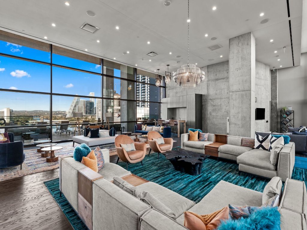 70 Rainey Street, Unit 2301 Austin, TX 78701 - Photo 32 of 40 a living room with lots of furniture and view of kitchen