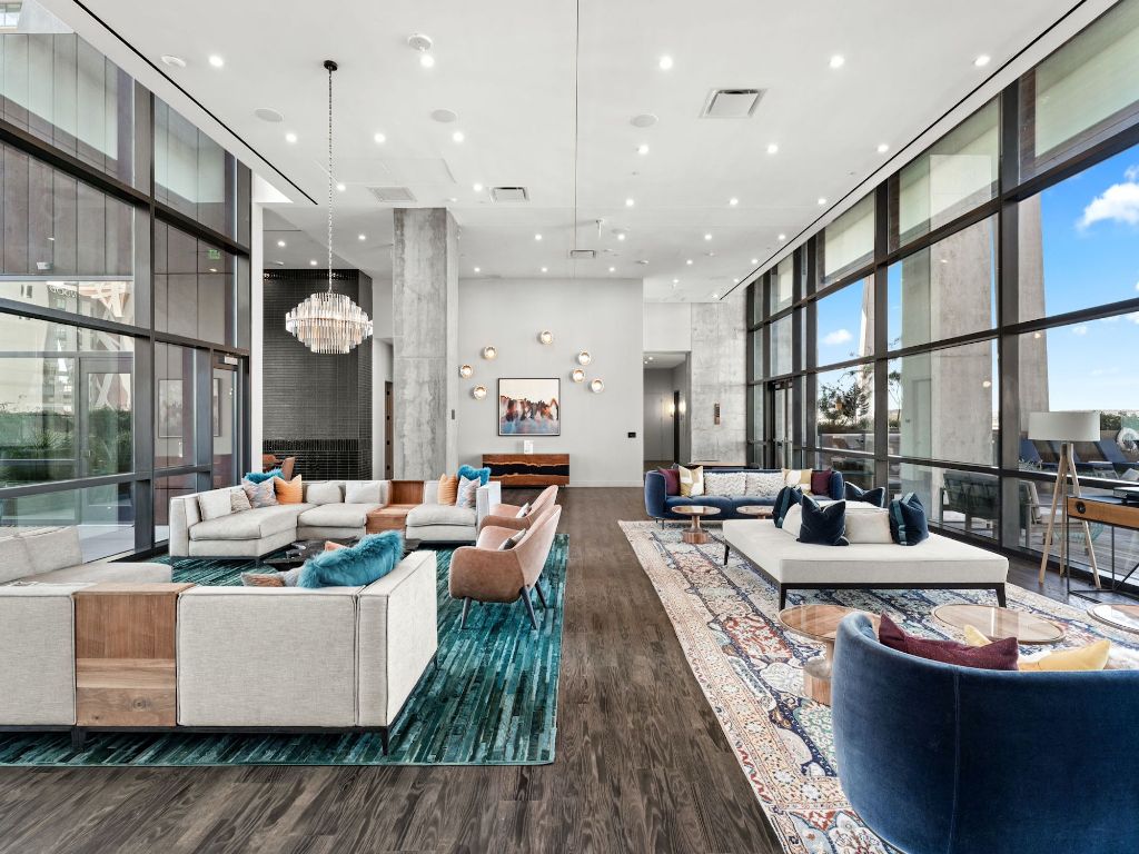 70 Rainey Street, Unit 2301 Austin, TX 78701 - Photo 33 of 40 a living room with patio furniture and a large window