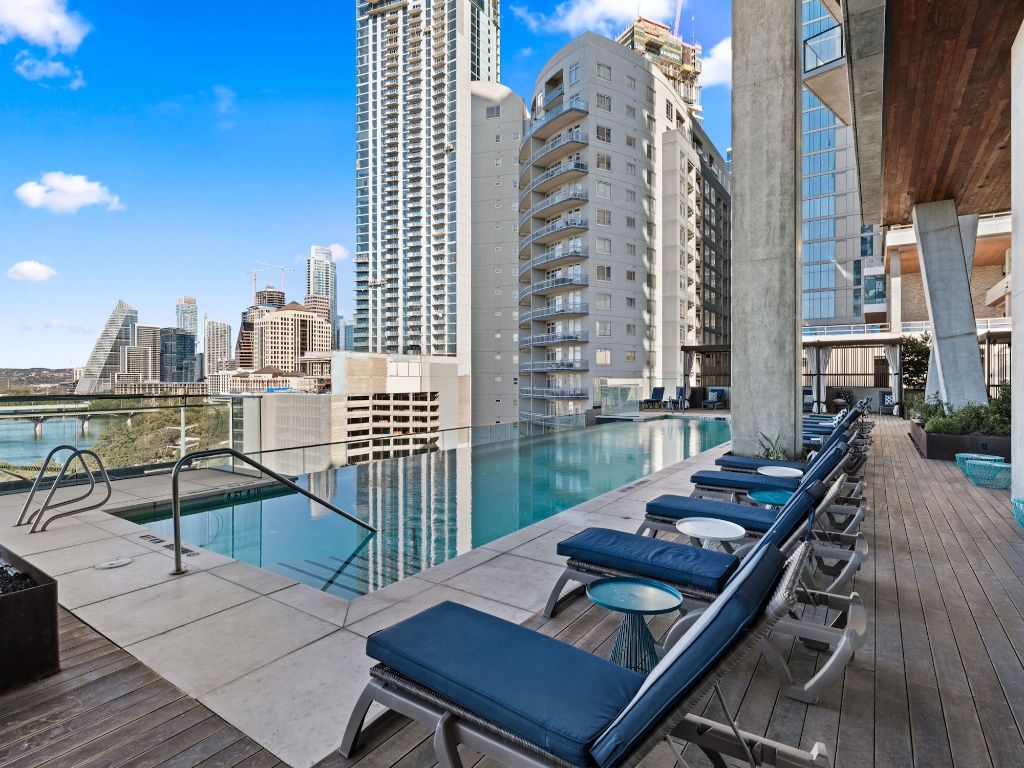 70 Rainey Street, Unit 2301 Austin, TX 78701 - Photo 38 of 40 a view of a balcony with two chairs and a table