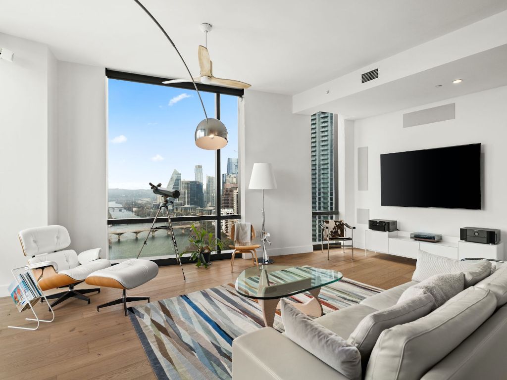 70 Rainey Street, Unit 2301 Austin, TX 78701 - Photo 5 of 40 a living room with furniture and a flat screen tv