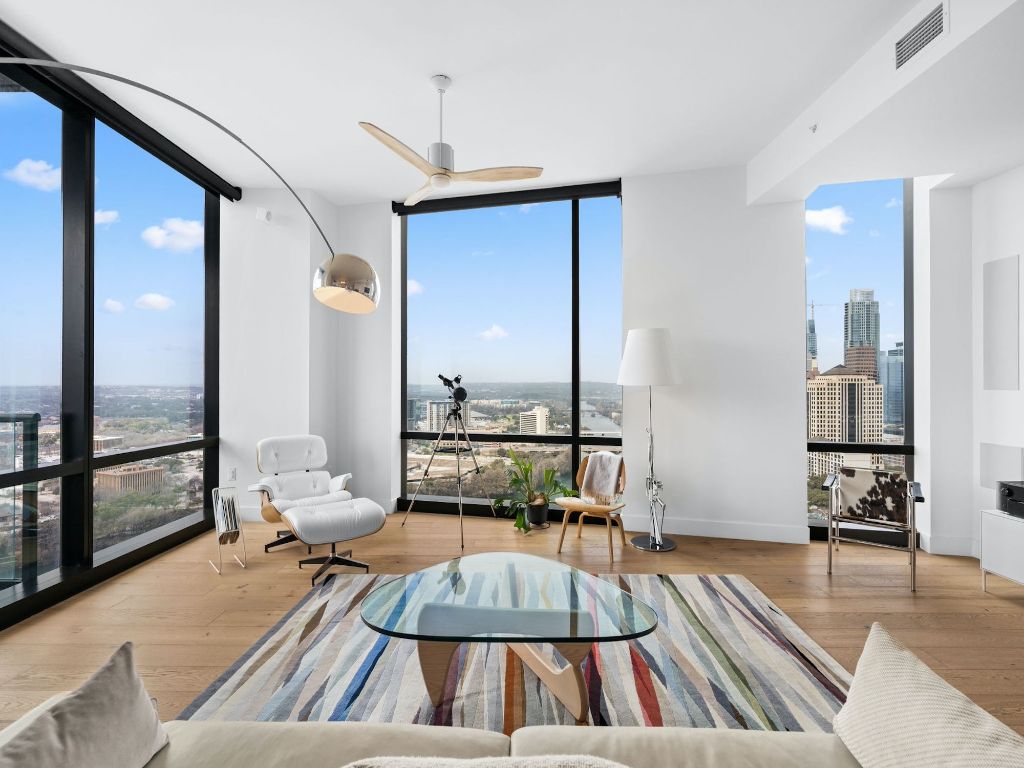 70 Rainey Street, Unit 2301 Austin, TX 78701 - Photo 6 of 40 a living room with couch and a large window