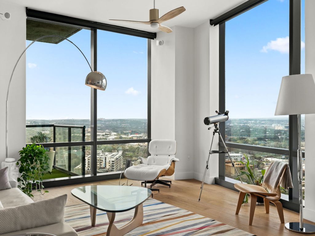 70 Rainey Street, Unit 2301 Austin, TX 78701 - Photo 7 of 40 a living room with furniture and a floor to ceiling window
