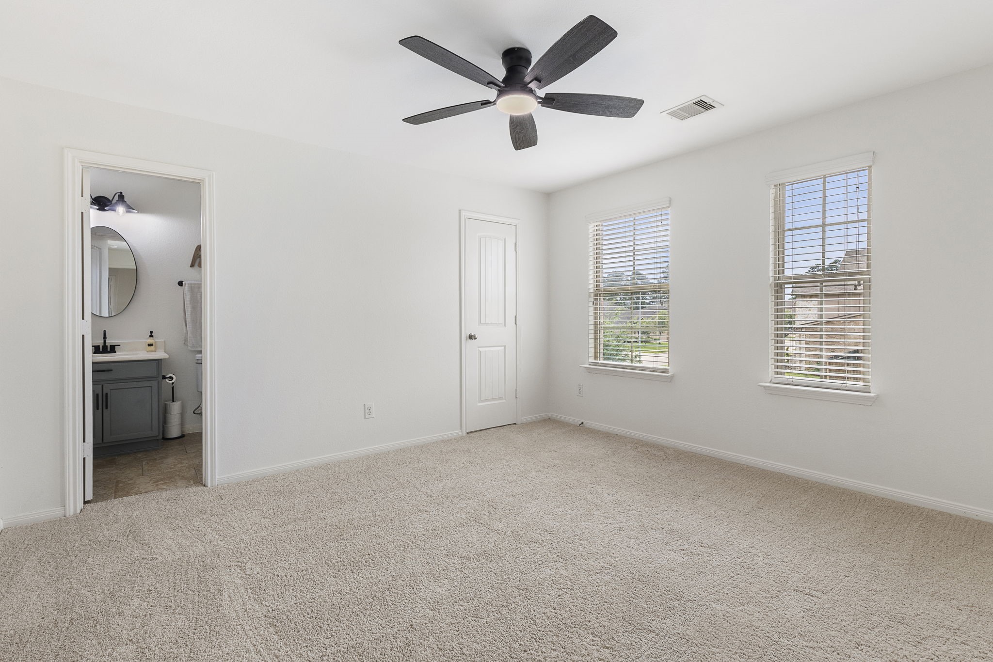 22810 Dale River Road Tomball, TX 77375 - Photo 23 of 44 One of four additional bedrooms upstairs. This one has a private ensuite bathroom.