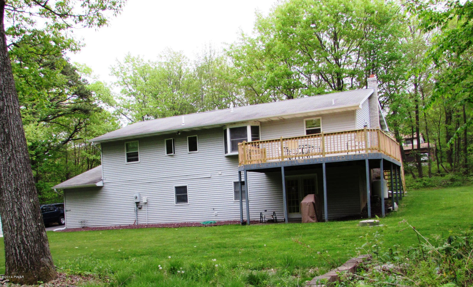 970 Forest Road Lake Ariel, PA 18436 - Photo 21 of 22 a front view of a house with a garden and yard
