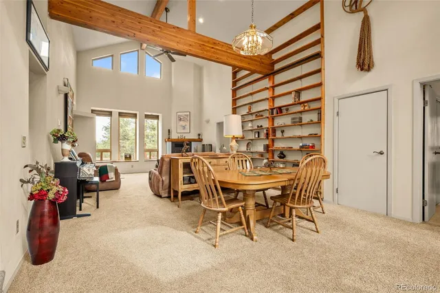 a view of a livingroom with furniture and a potted plant