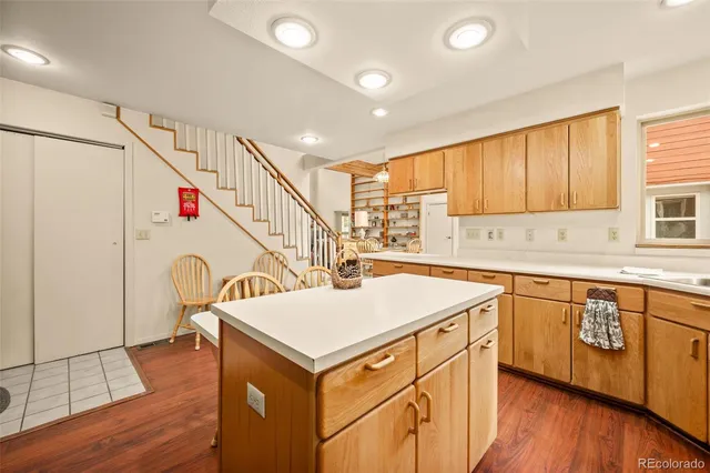 a kitchen with a stove a sink and a refrigerator