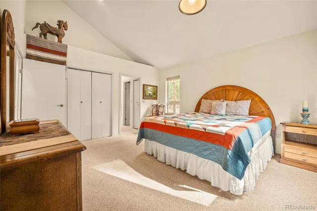 a bedroom with a bed and a stove