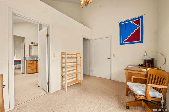 a view of a livingroom with furniture and staircase