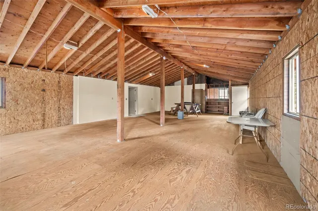a view of a room with wooden walls