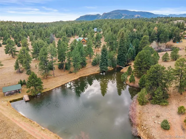 a view of a lake with mountain