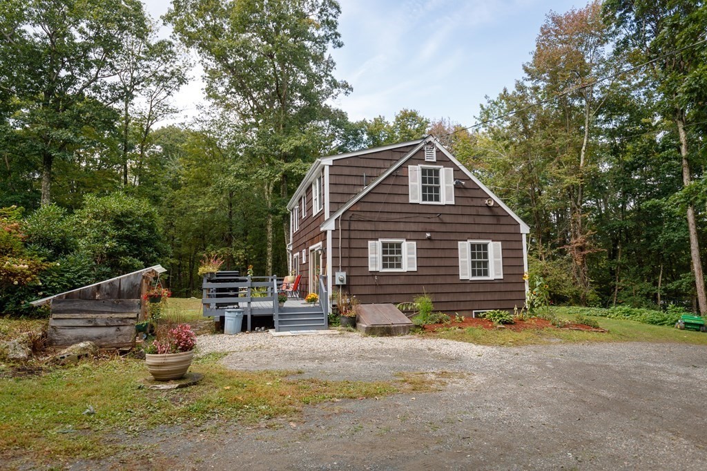 301 Main Road Montgomery, MA 01085 - Photo 3 of 41 a front view of a house with a yard