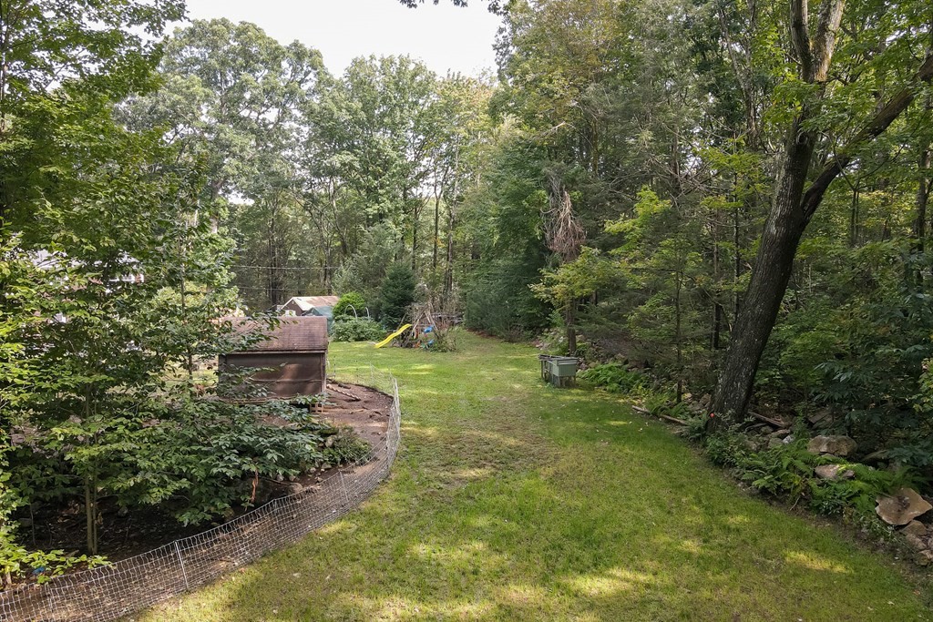 301 Main Road Montgomery, MA 01085 - Photo 35 of 41 a backyard of a house with table and chairs