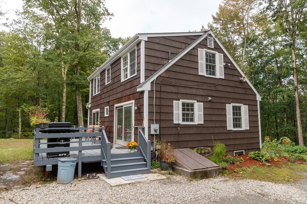 301 Main Road Montgomery, MA 01085 - Photo 5 of 41 a view of a house with a yard and furniture