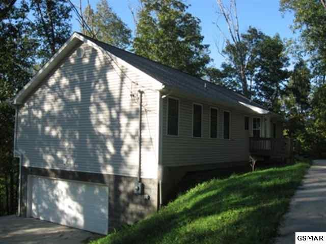 1825 Rays Gap Road Sevierville, TN 37876 - Photo 1 of 1 a front view of a house with garden