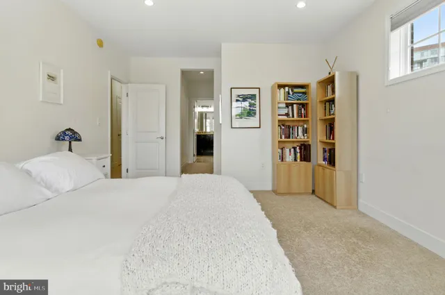 a bedroom with a bed and closet