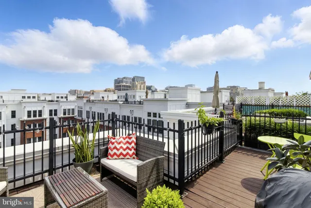 a view of a balcony with wooden floor
