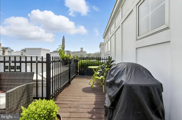 a view of balcony with wooden floor