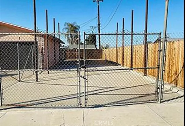 a view of a kitchen with wooden floor and a sink