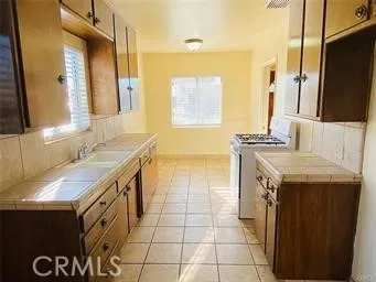 a view of an empty room with a fireplace