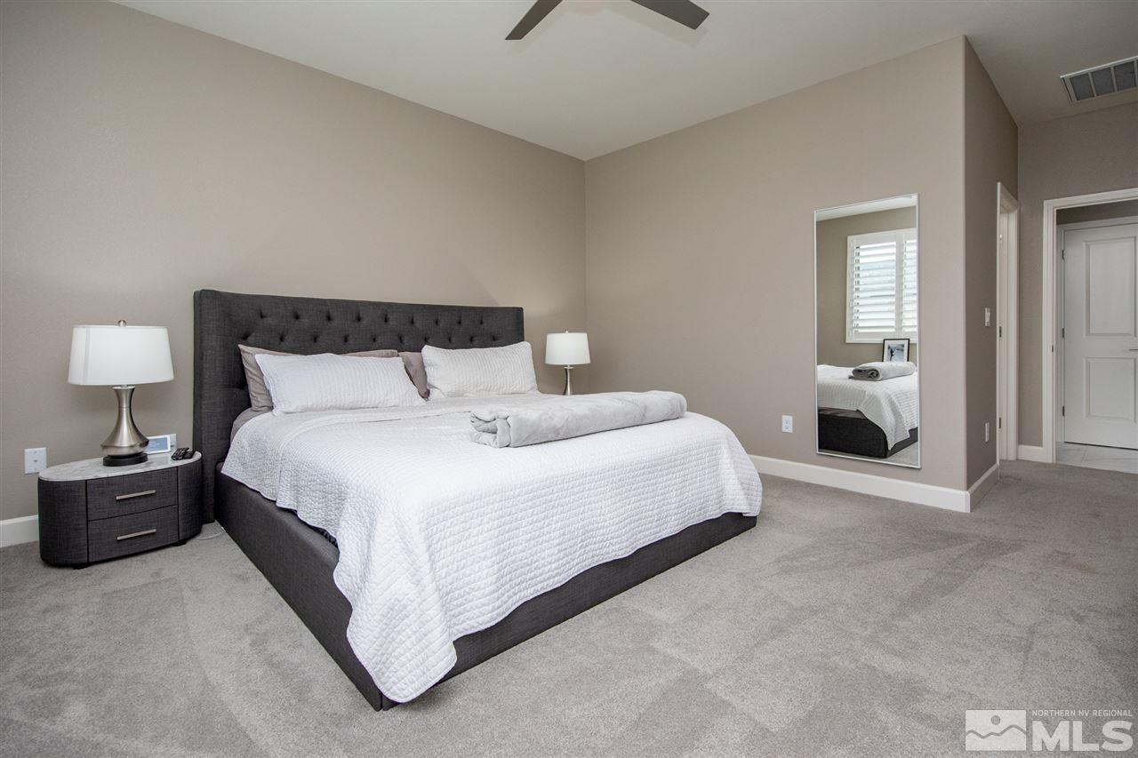 601 Riverbed Circle Reno, NV 89521 - Photo 13 of 31 a bedroom with a bed and window