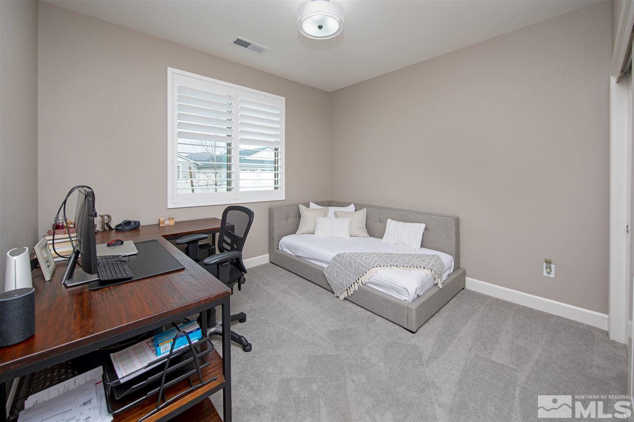 601 Riverbed Circle Reno, NV 89521 - Photo 20 of 31 a living room with furniture and a window