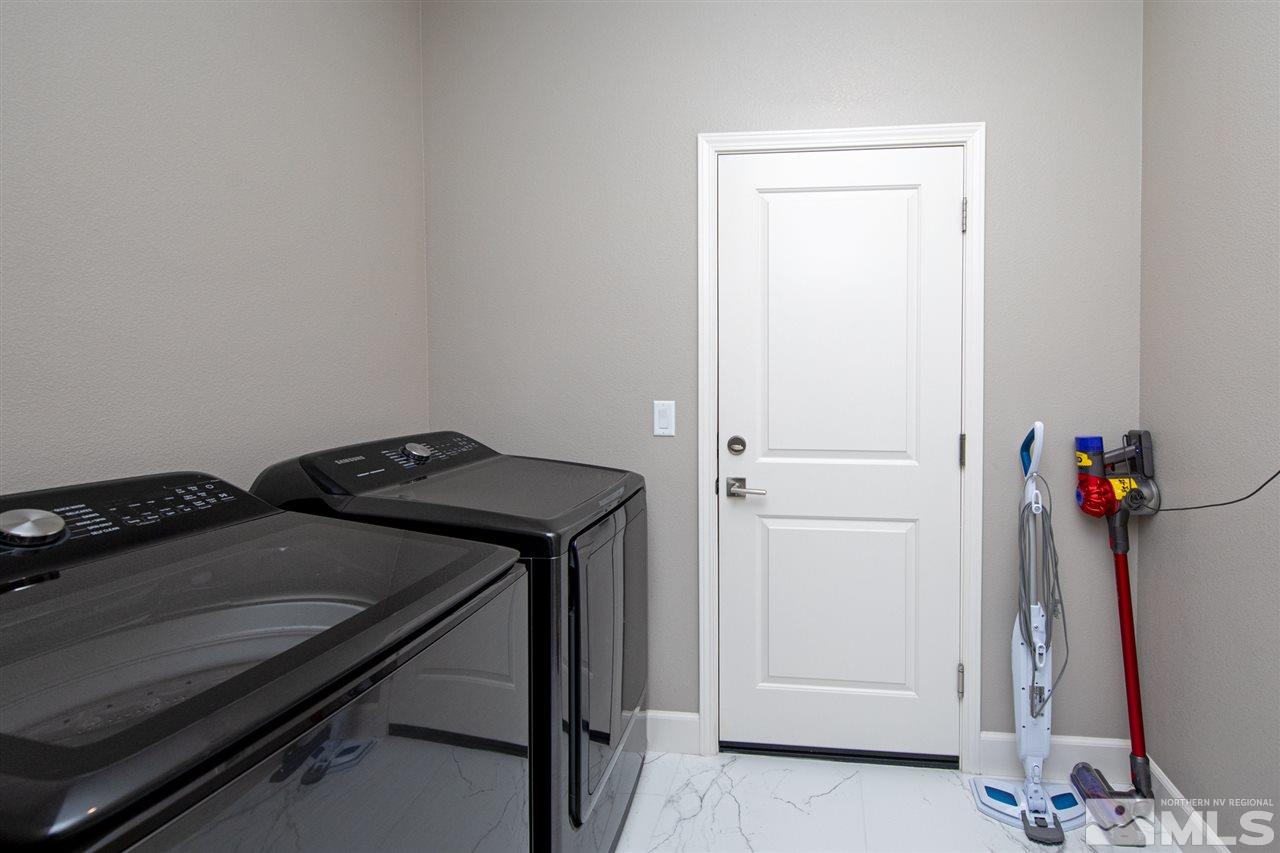 601 Riverbed Circle Reno, NV 89521 - Photo 21 of 31 a utility room with dryer and washer