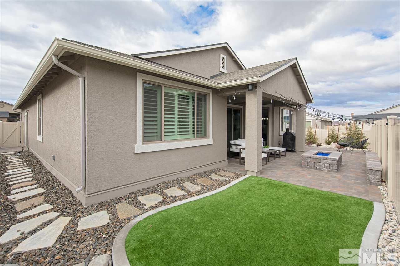 601 Riverbed Circle Reno, NV 89521 - Photo 22 of 31 a view of a house with backyard and sitting area