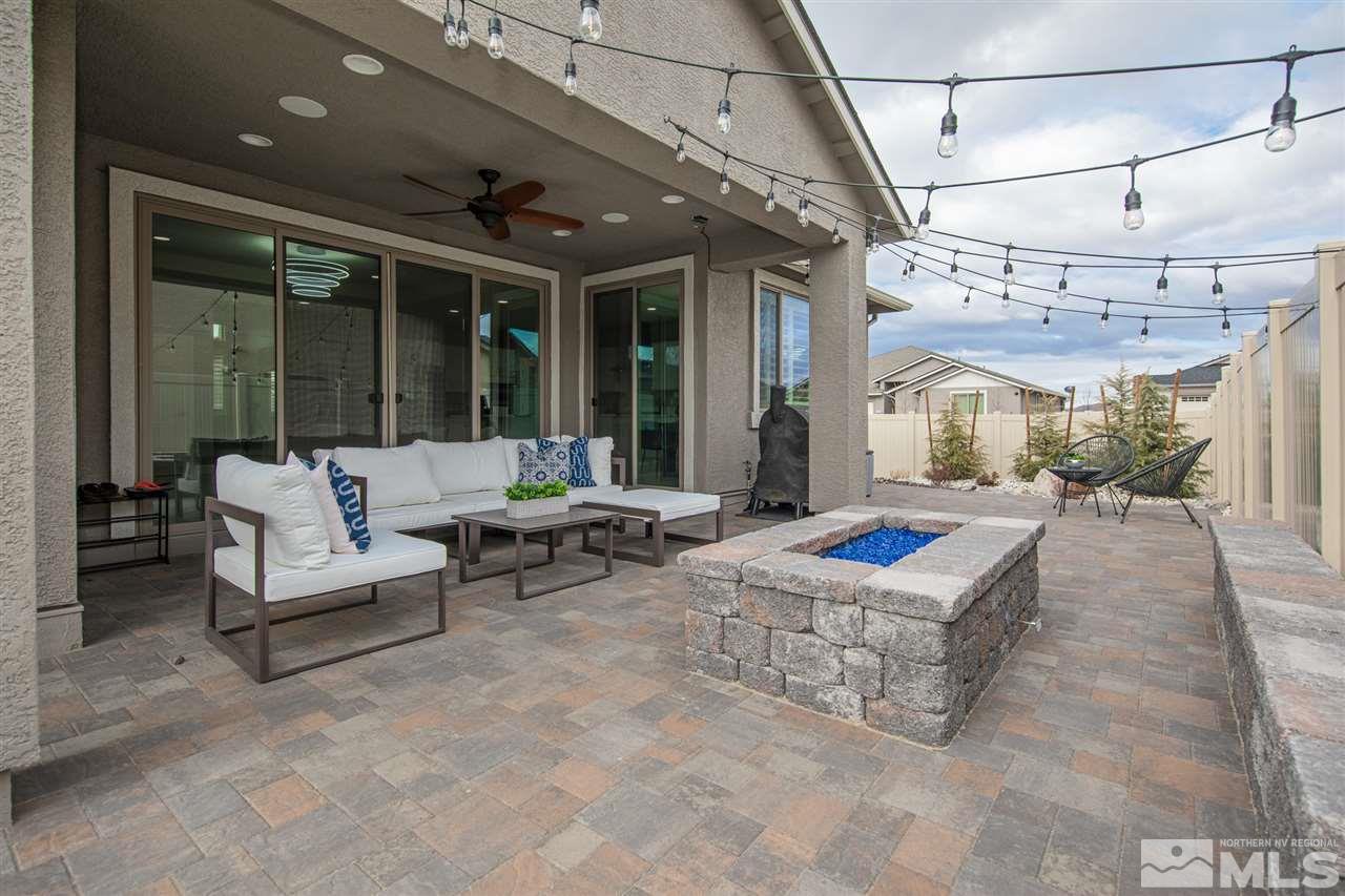 601 Riverbed Circle Reno, NV 89521 - Photo 23 of 31 a balcony with furniture and a chandelier
