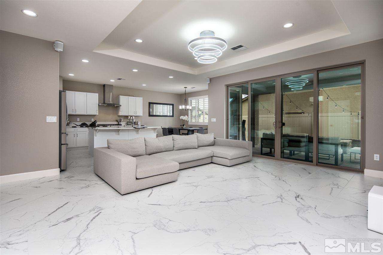 601 Riverbed Circle Reno, NV 89521 - Photo 3 of 31 a living room with furniture and a large window