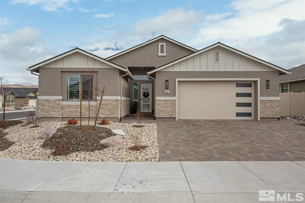 601 Riverbed Circle Reno, NV 89521 - Photo 31 of 31 a view of a house with a yard and garage