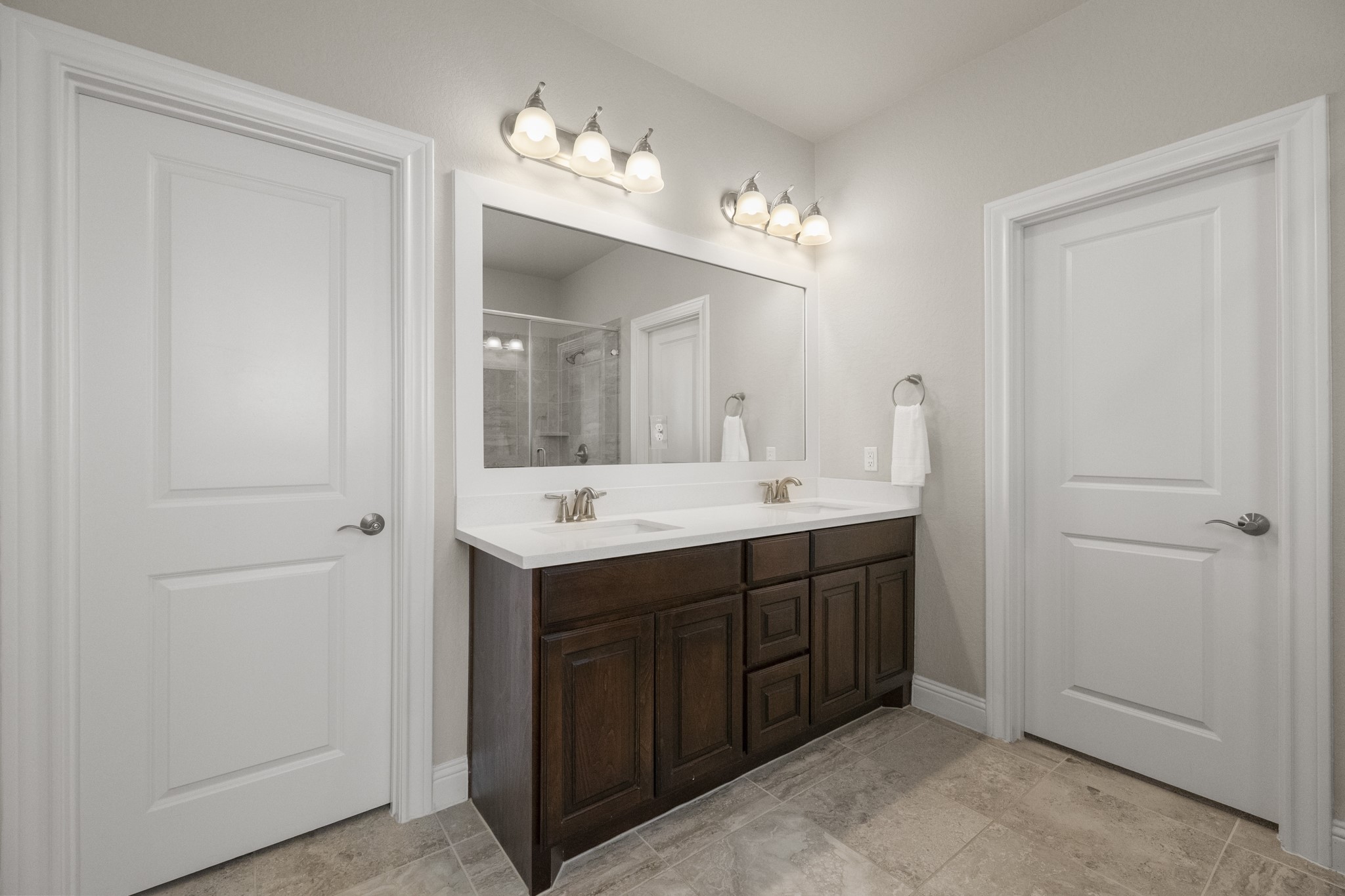 7502 Windsor Park Court Spring, TX 77379 - Photo 21 of 50 a bathroom with a double vanity sink and a mirror