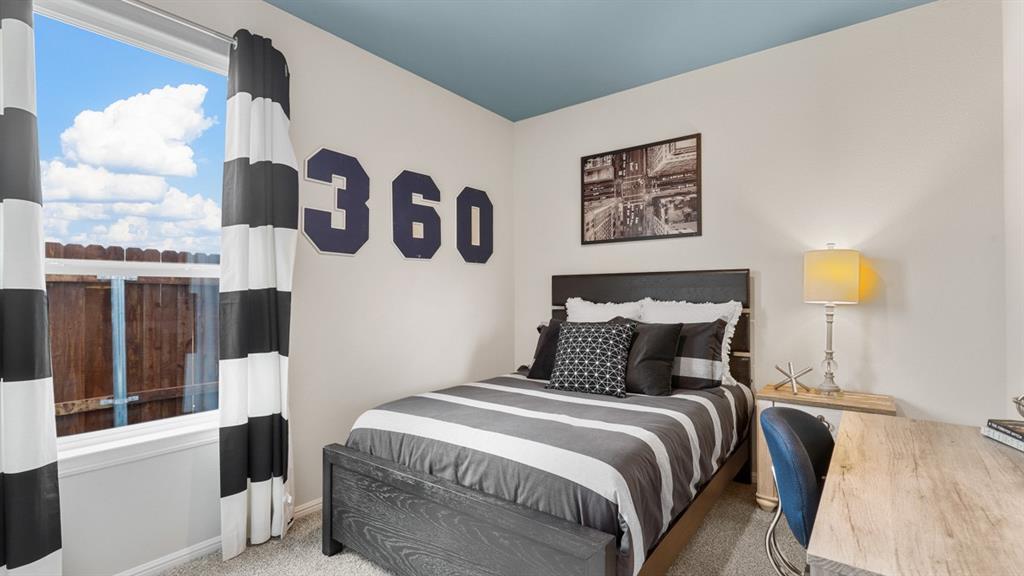 3053 Maple Orch Lane Fort Worth, TX 76140 - Photo 24 of 38 a bedroom with a bed and painting on the wall