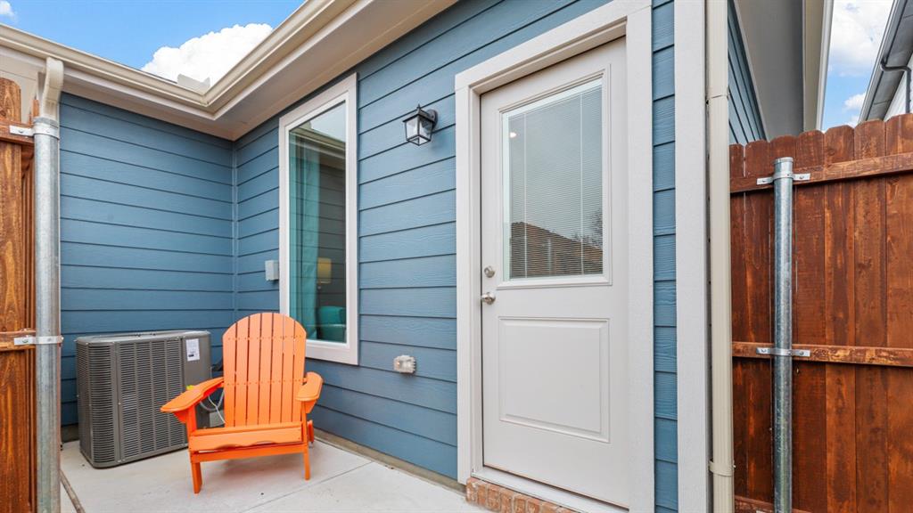 3053 Maple Orch Lane Fort Worth, TX 76140 - Photo 37 of 38 a view of a door with a bench and wooden fence