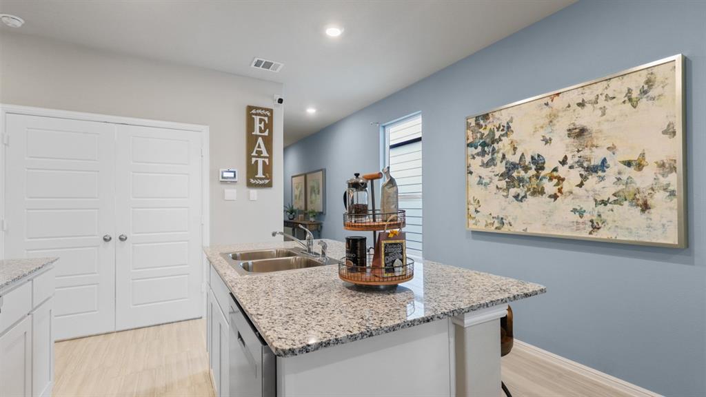 3053 Maple Orch Lane Fort Worth, TX 76140 - Photo 2 of 38 a kitchen with a table and chairs