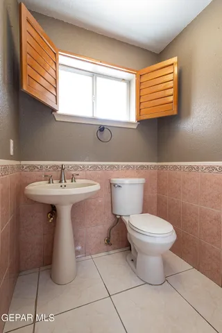 a view of an entryway with wooden floor and windows