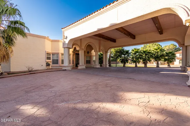 a view of a swimming pool and an outdoor space