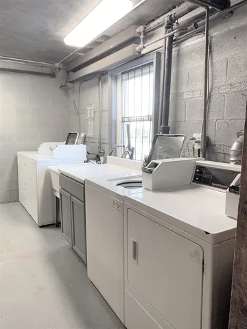 a room with a large bed and a window