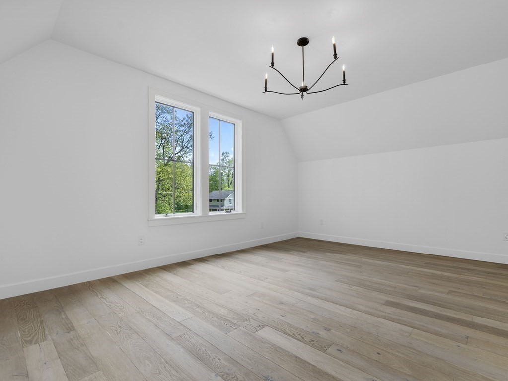 23 Alpine Road Wayland, MA 01778 - Photo 14 of 25 a view of an empty room with wooden floor and a window