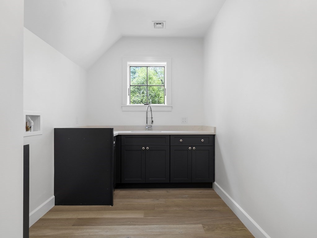 23 Alpine Road Wayland, MA 01778 - Photo 16 of 25 a room with a sink and a mirror