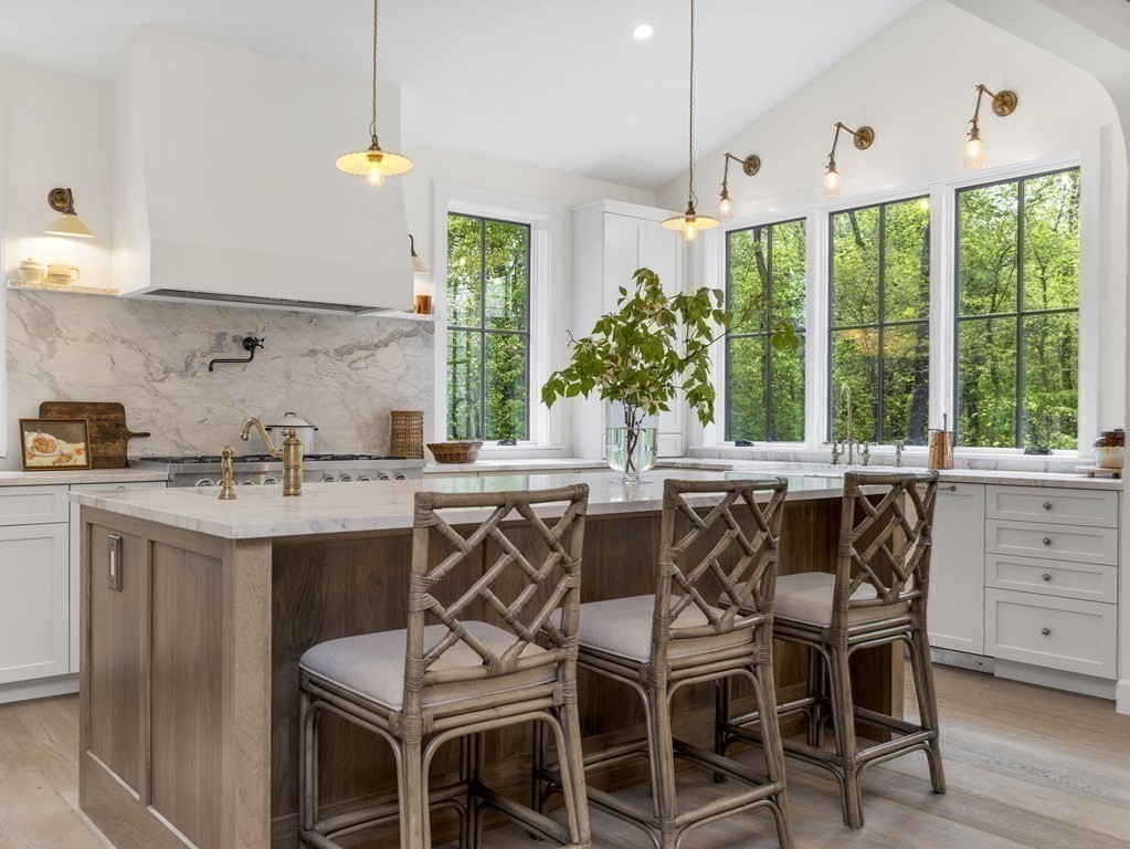 23 Alpine Road Wayland, MA 01778 - Photo 21 of 25 a kitchen with a table chairs sink and cabinets