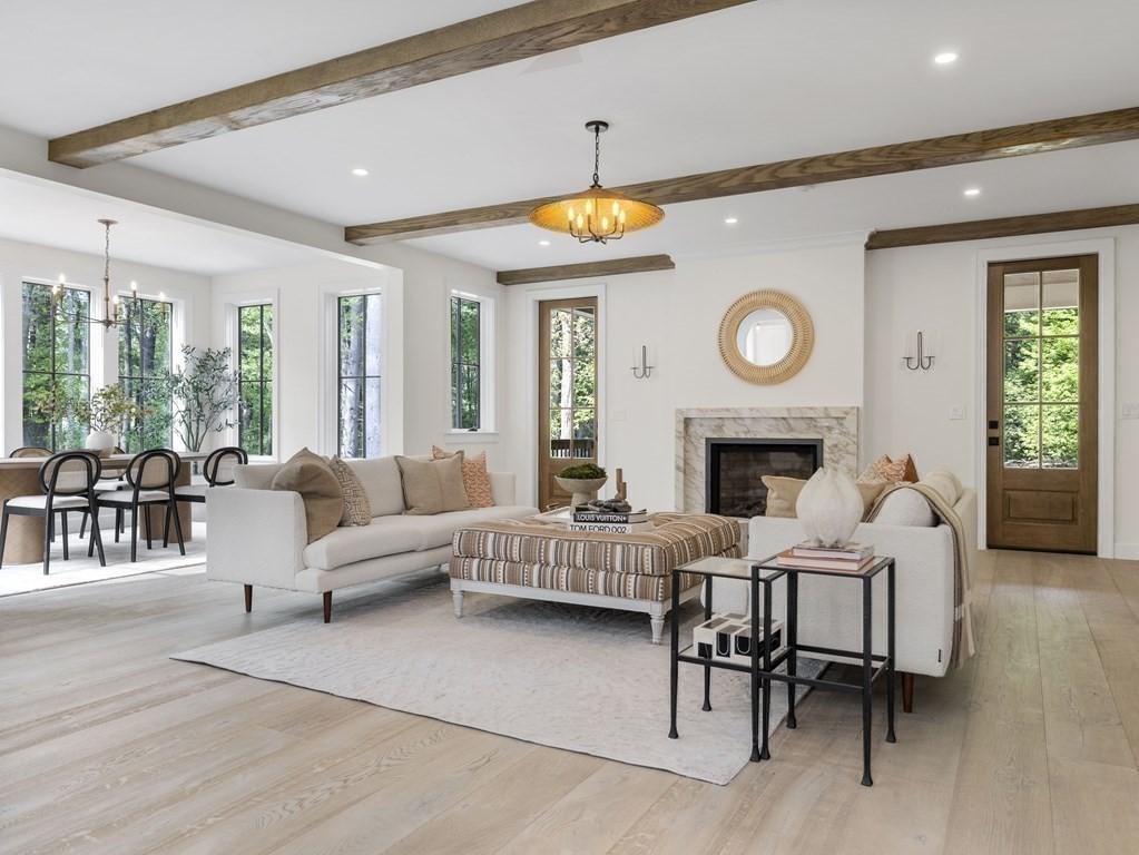 23 Alpine Road Wayland, MA 01778 - Photo 3 of 25 a living room with furniture a clock and a fireplace
