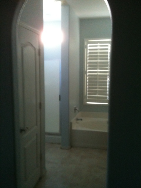 3235 West Maldonado Road Phoenix, AZ 85041 - Photo 14 of 17 a bathroom with a bathtub and shower