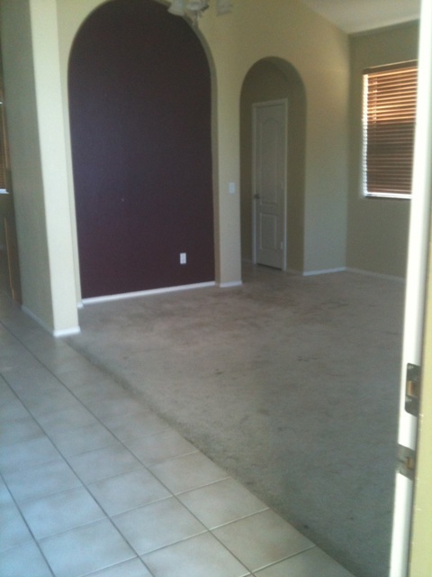 3235 West Maldonado Road Phoenix, AZ 85041 - Photo 2 of 17 a view of an empty room with windows