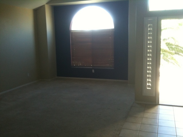 3235 West Maldonado Road Phoenix, AZ 85041 - Photo 3 of 17 an empty room with windows