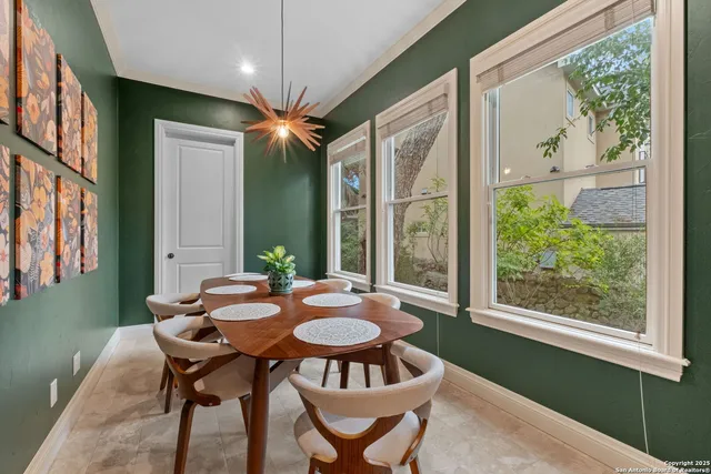 a view of a dining room with furniture window and outside view