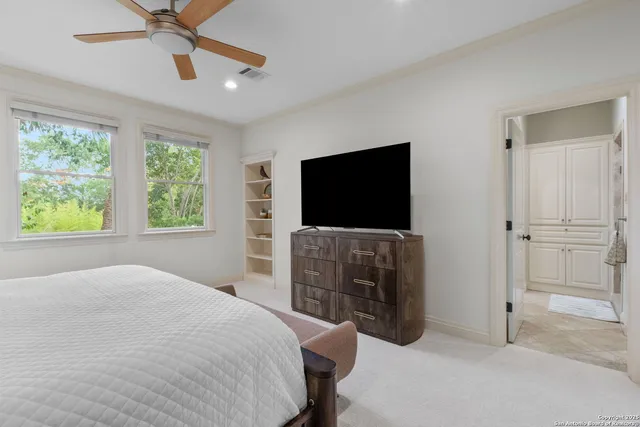 a large bathroom with double vanity and a mirror or bathtub